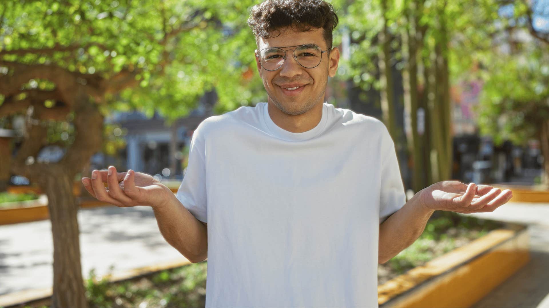 man with low intelligence shrugging saying i don't see the point