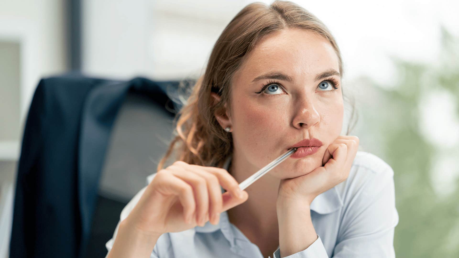 woman deep in thought saying i heard it somewhere