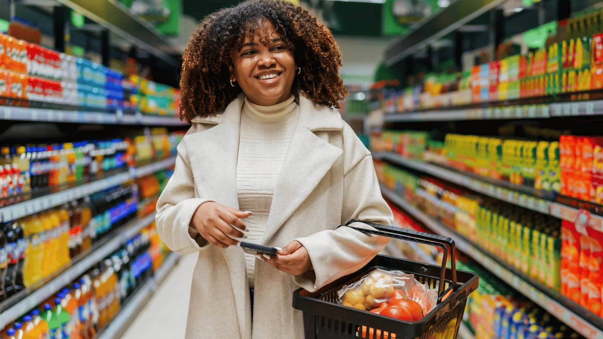 smiling gen Z woman shopping at a luxury food market