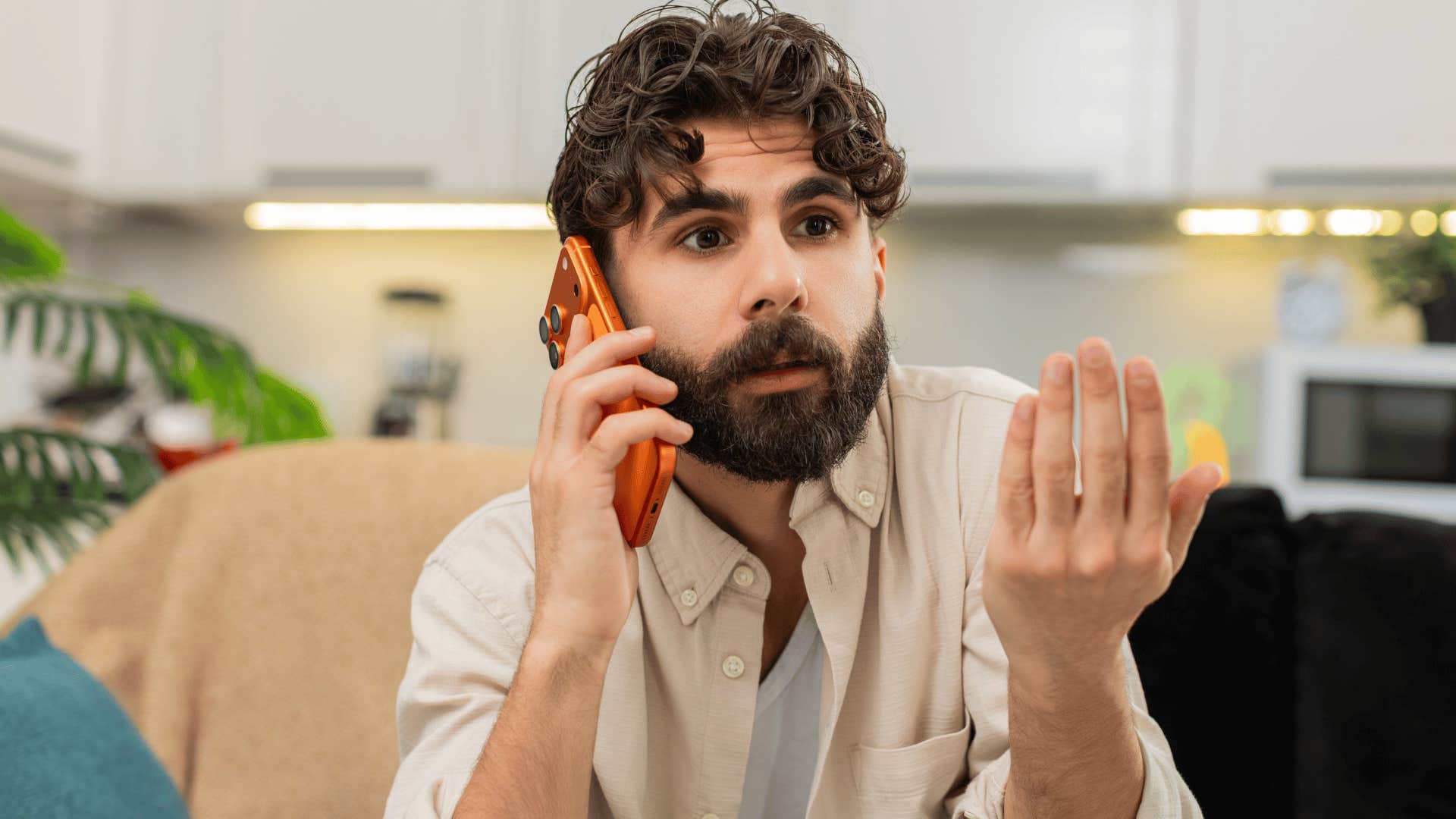 man arguing on the phone as he ends with do what you want i don't care