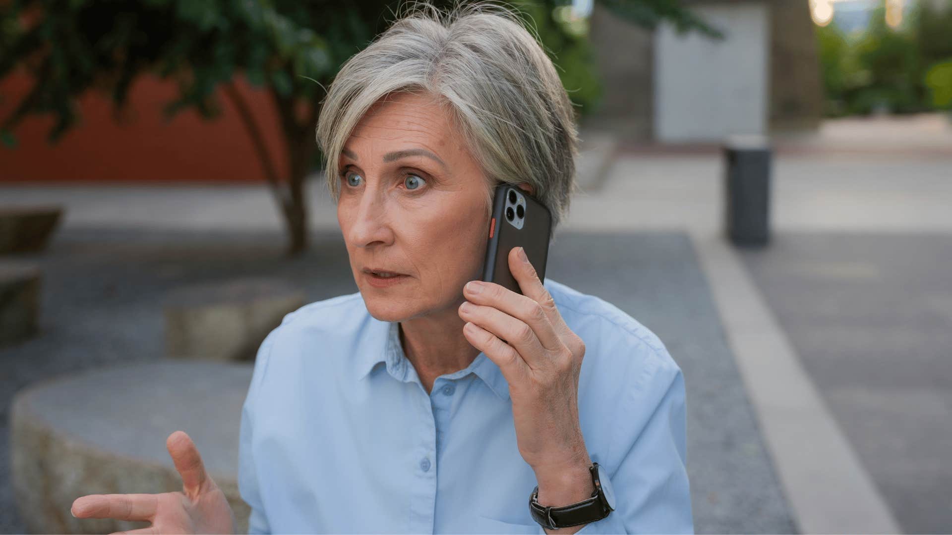 woman in blue shirt annoyed on the phone as she says it doesn't even matter anymore
