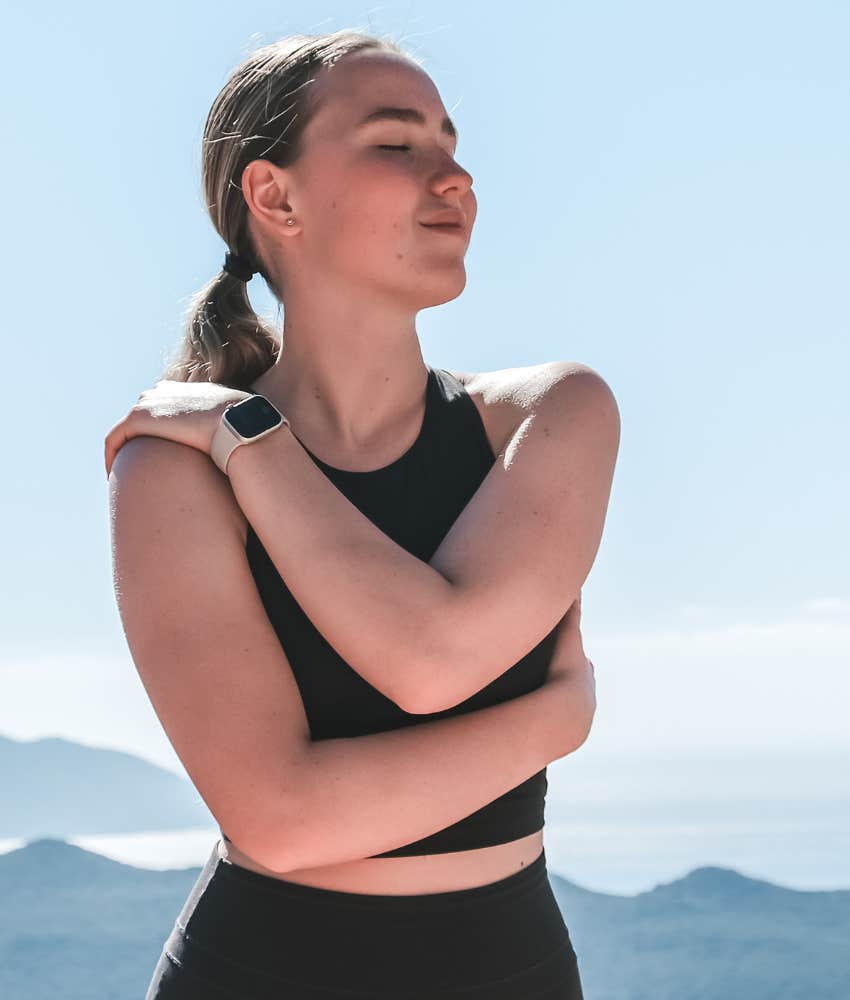 Woman who needs alone time to recharge because she's evolved stands outside 