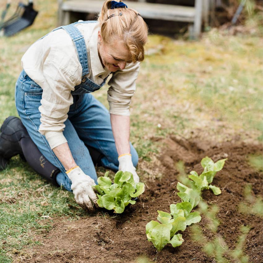 older woman tending to her garden outside