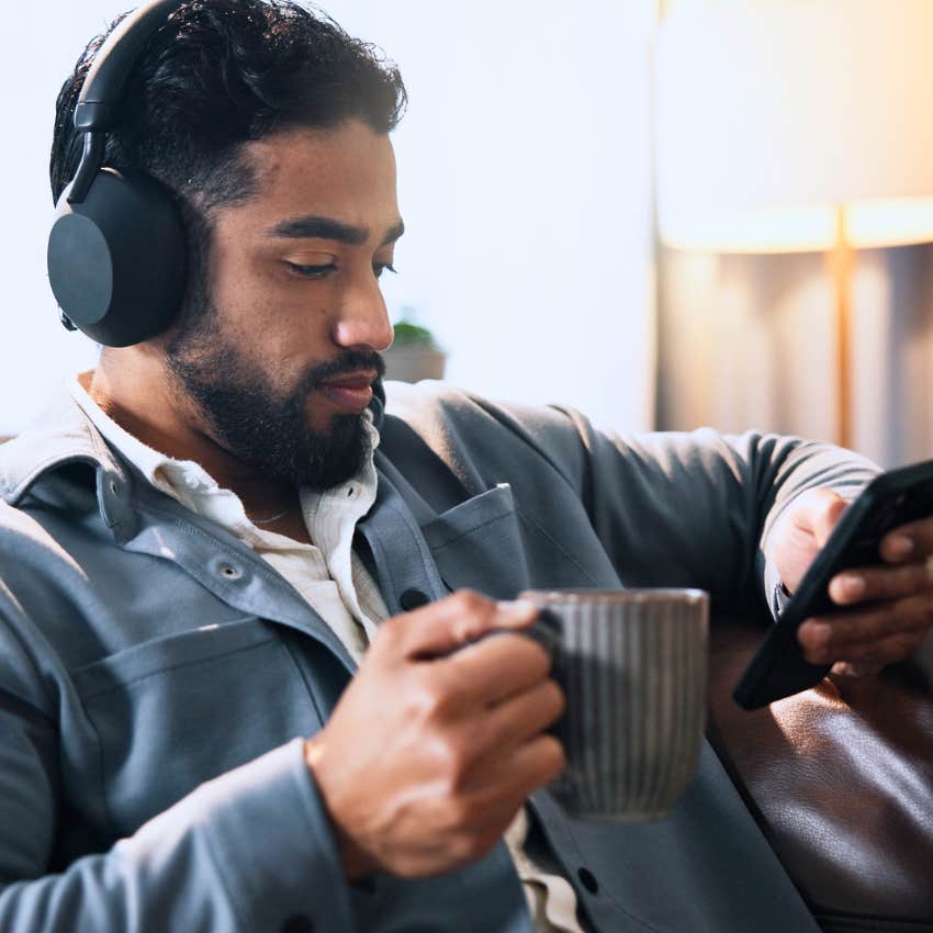 Gen Z man gaming and watching content from creators on his phone.
