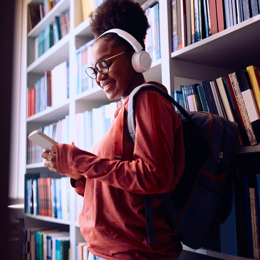 young girl in the library with accessible higher education
