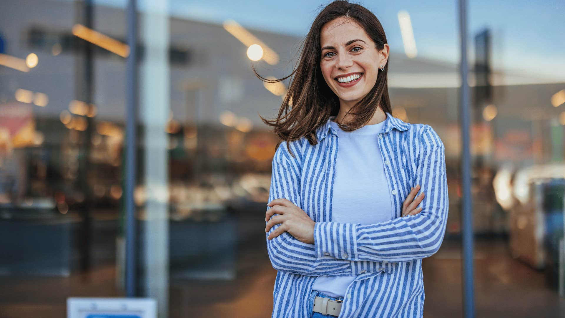 woman crossing arms while smiling as she has a ton of gratitude