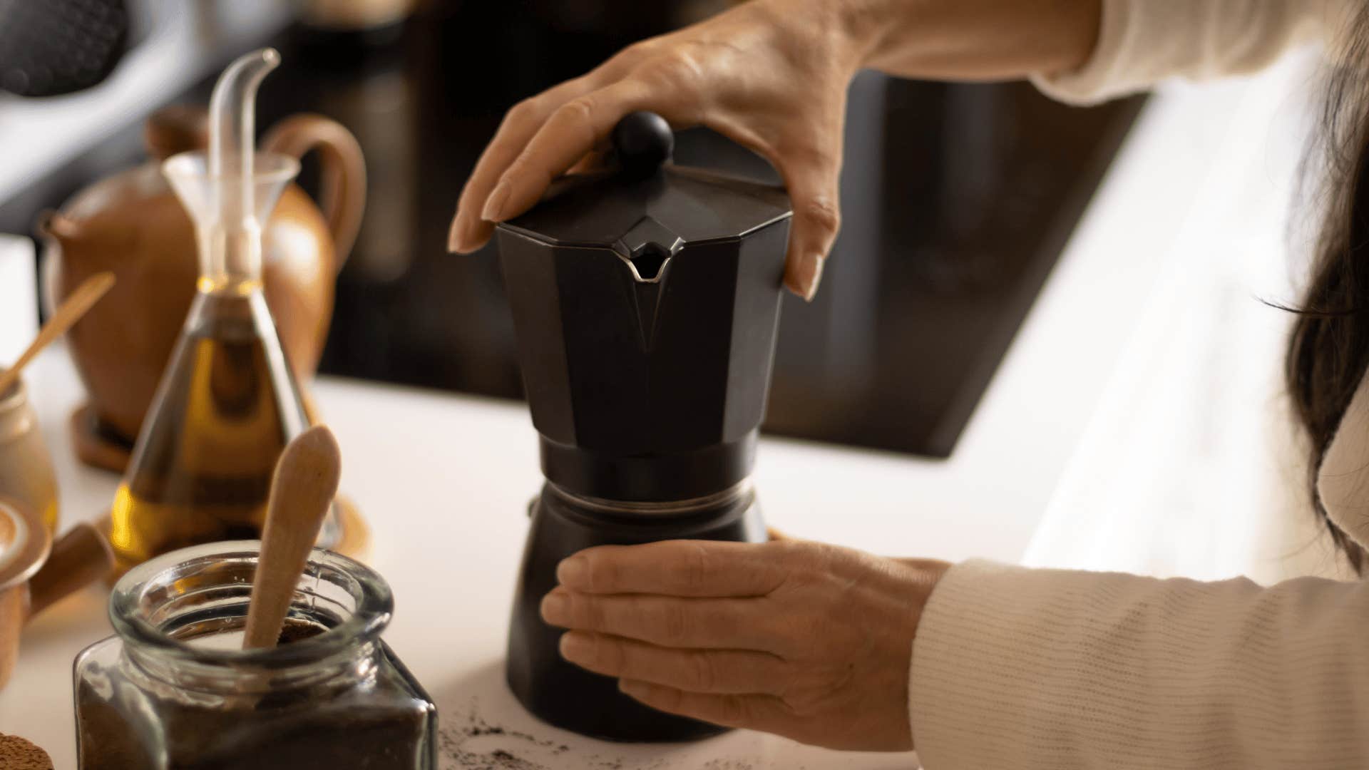 woman making coffee at her fully stocked coffee station