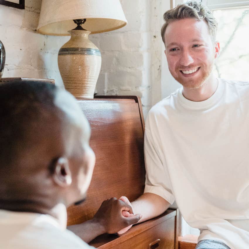 man finding comfort in partner supporting him