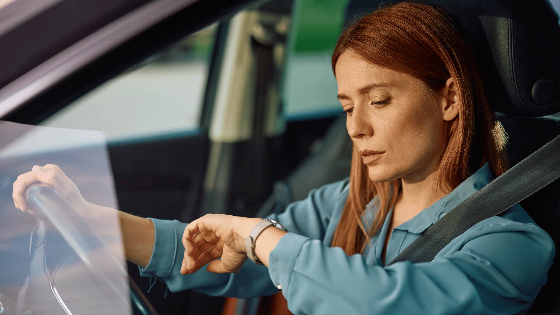 woman checking watch as she's used to being chronically late