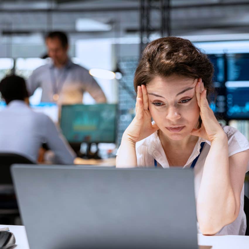 woman trying to be respectful by ignoring a conversation at work