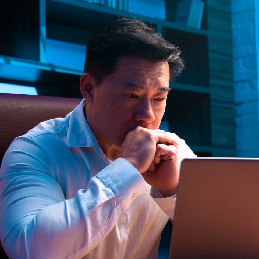 Man trying to prove themselves while looking at a laptop.