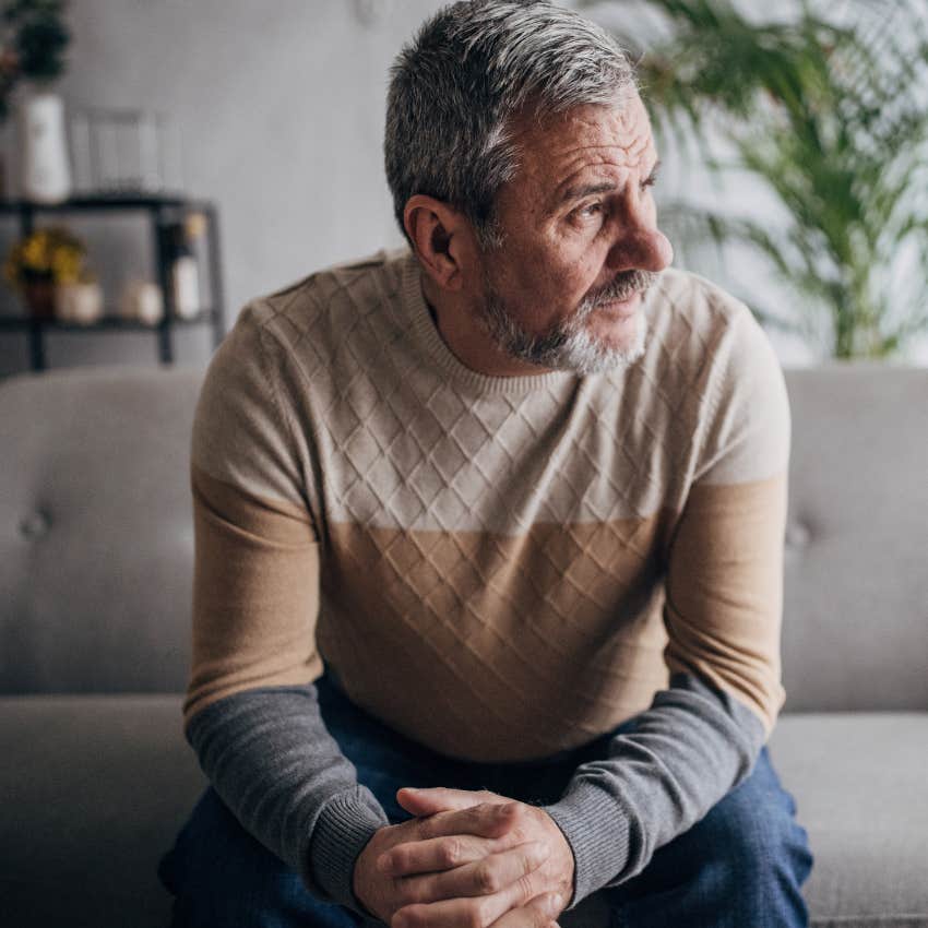 heartbroken man staying home and thinking