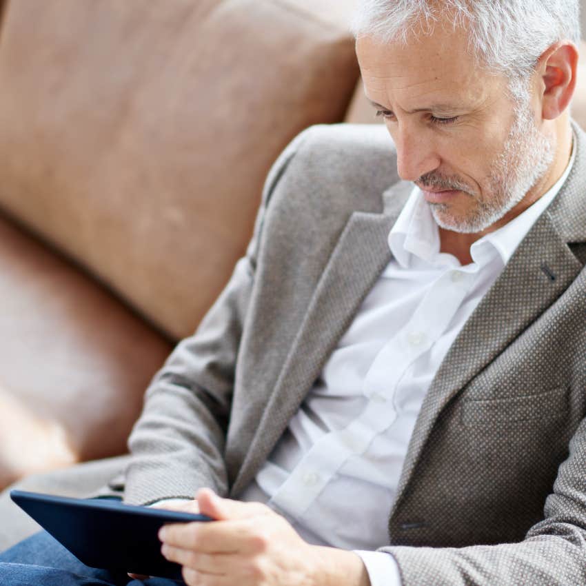 man reading an article on his device