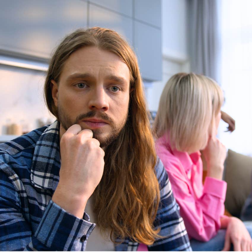 pensive sad man feeling excluded with his friends
