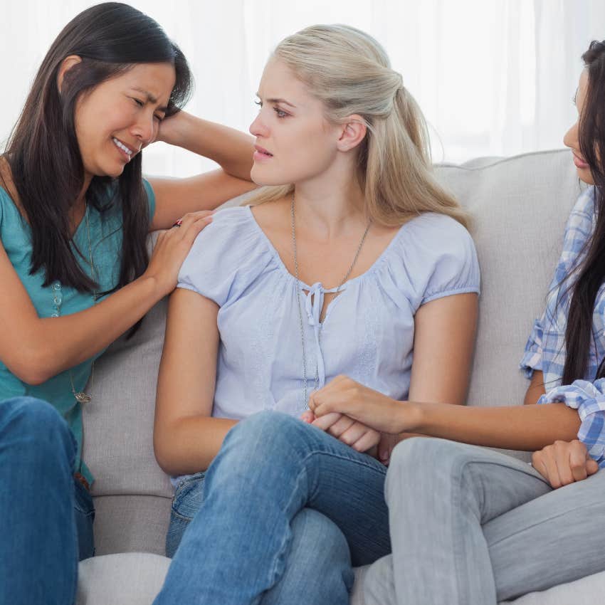 dramatic woman crying to her friends