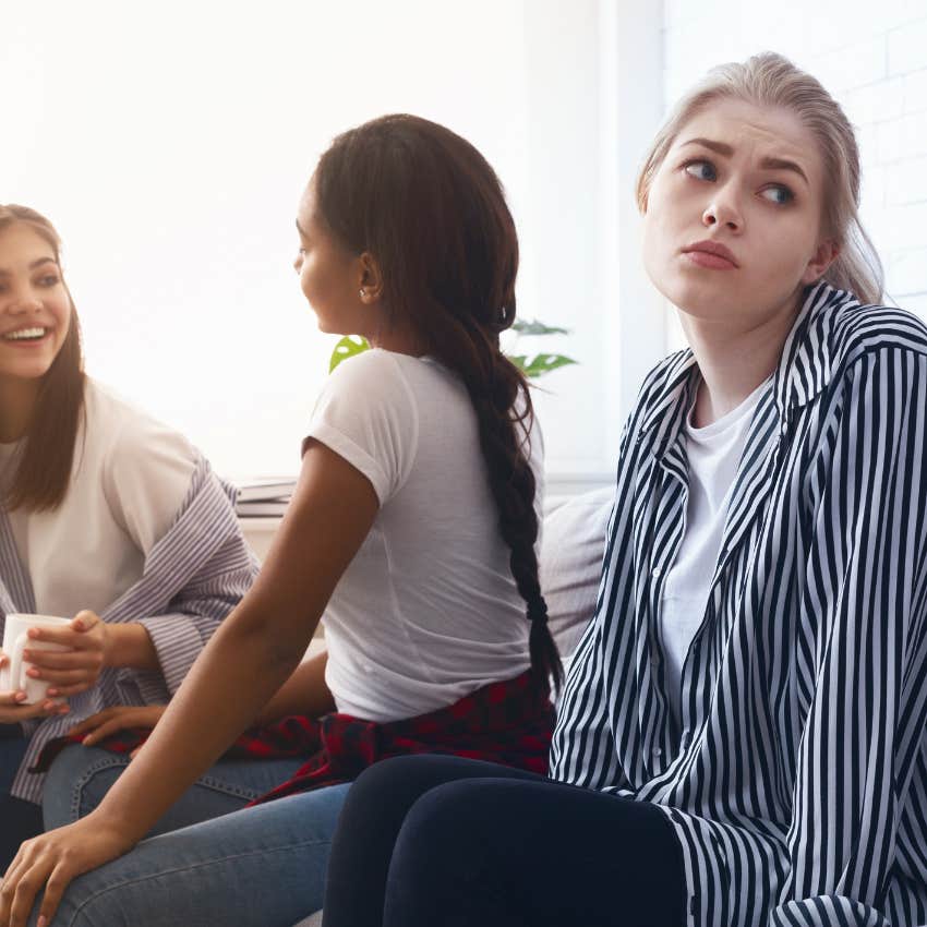 sad girl wondering why her friends left her out of the conversation