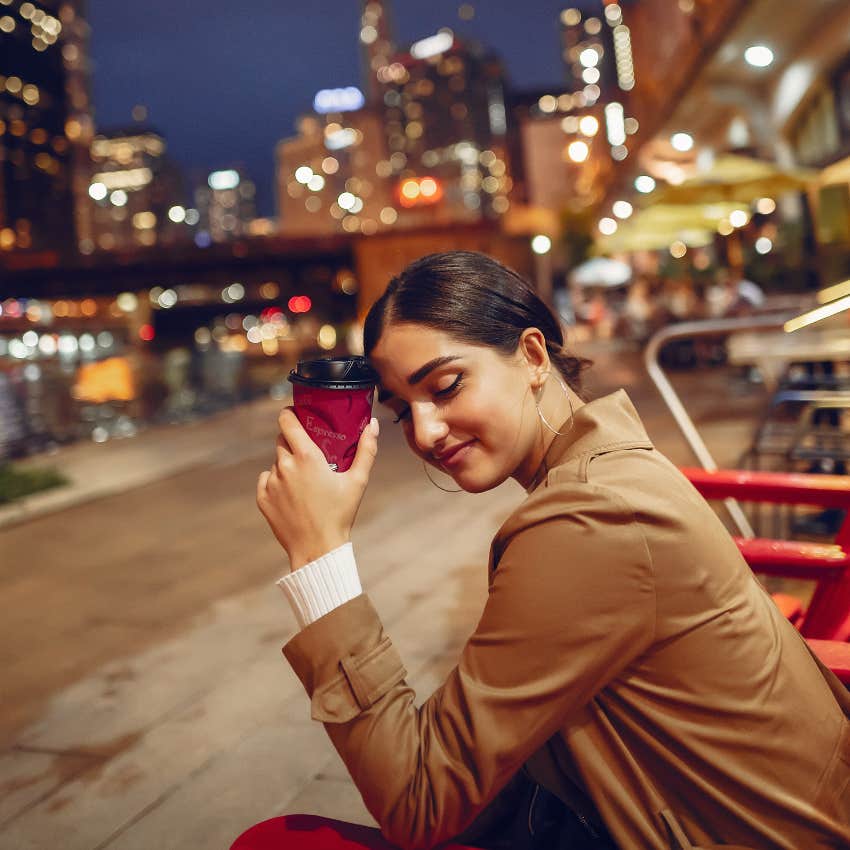 tired woman drinking more coffee at night