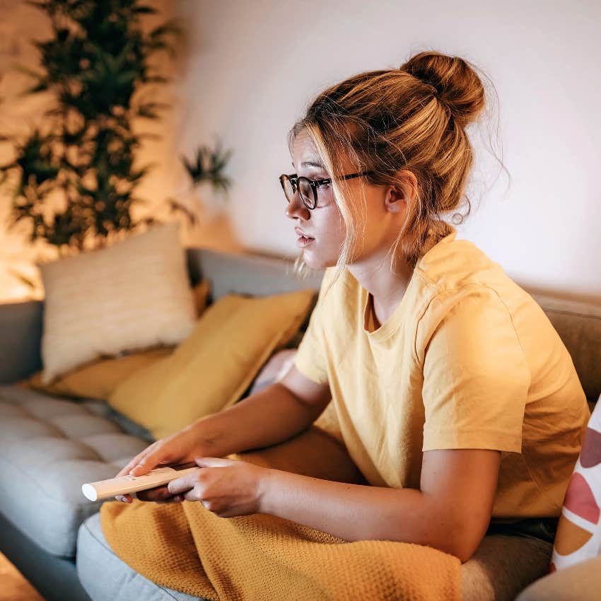 Woman decompressing by watching TV