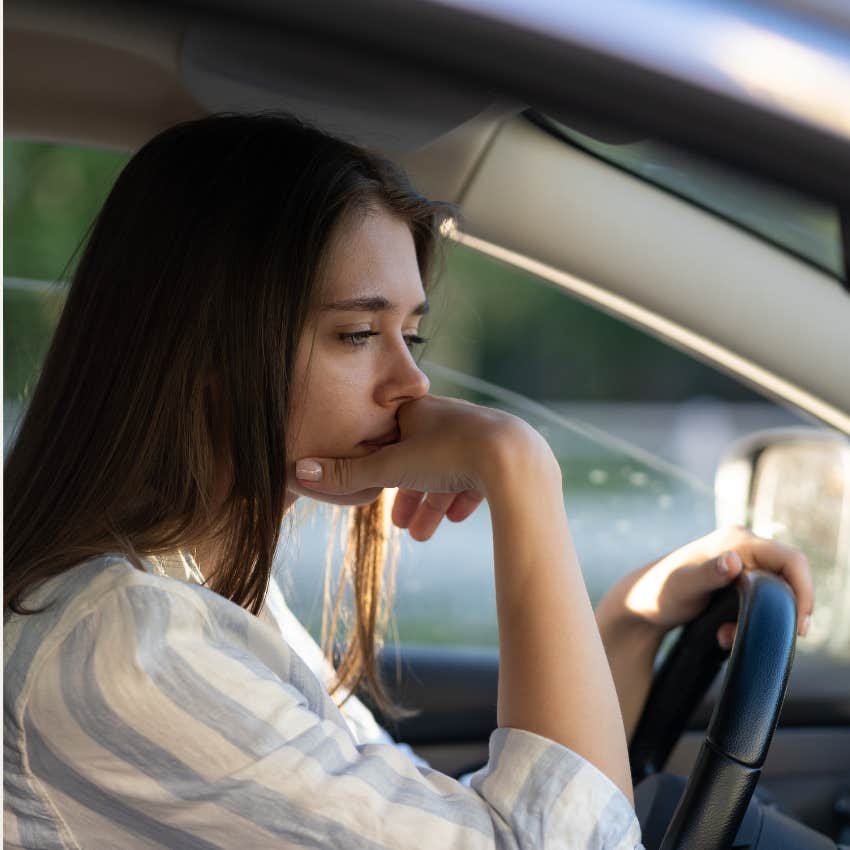 woman craves freedom but cant handle what they are going through sits sadly in a car