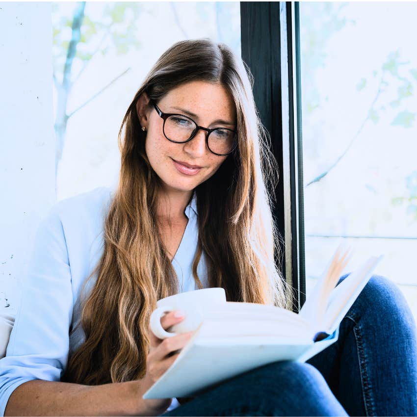 introverted woman reading and sitting at home alone