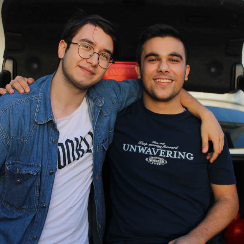 two male best friends smiling together enjoying each other's company