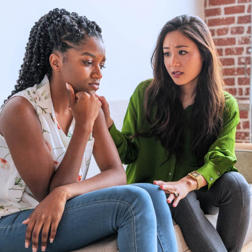 serious woman saying I'm going through it to her friend