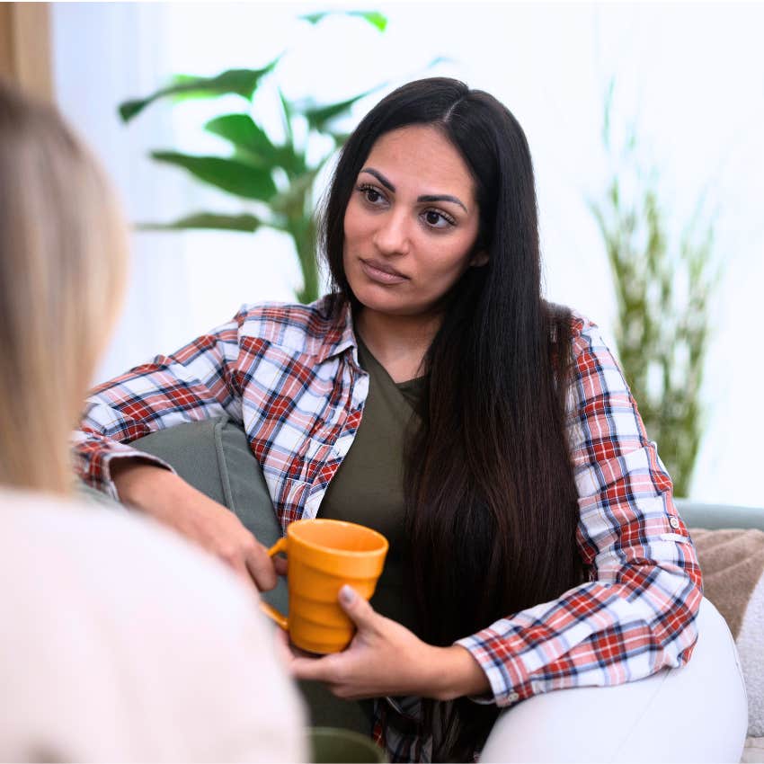 bad friend telling woman that's so embarrassing in conversation
