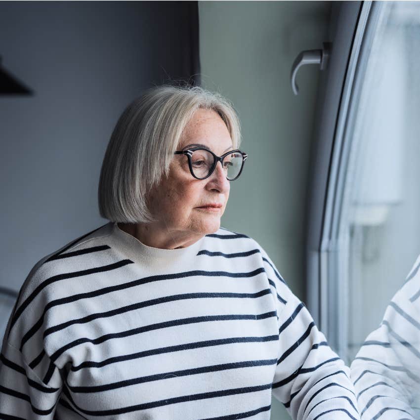 Woman outgrowing an old version of themselves at home.