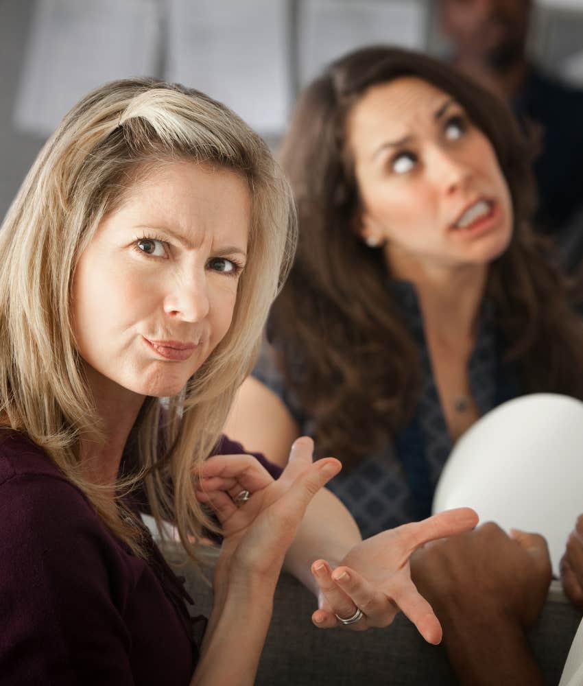 Woman pretending to be cool but is judging the other woman's excitement