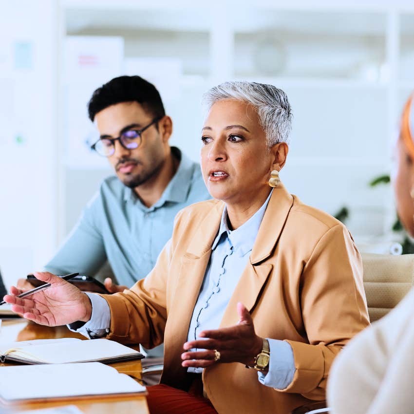 Woman saying "no" in a work meeting.