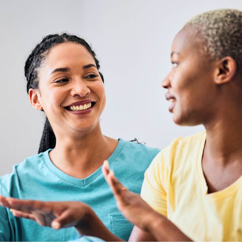 Woman saying "I changed my mind" to her friend at home.