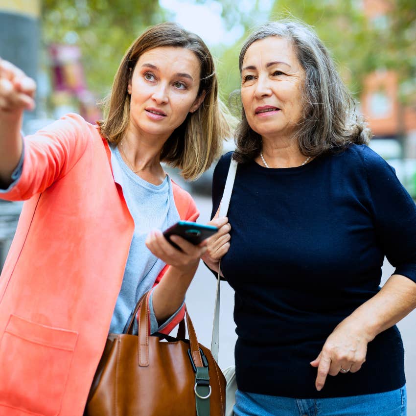 Woman saying "let me help" to a stranger in public.