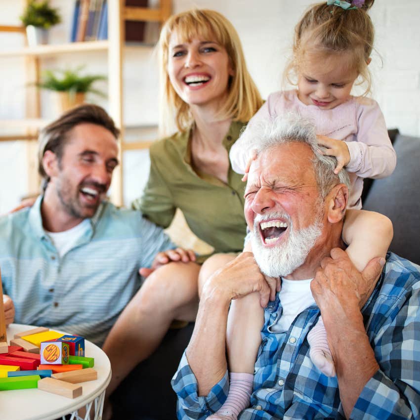 grandfather making his adult child's visit fun with their kids