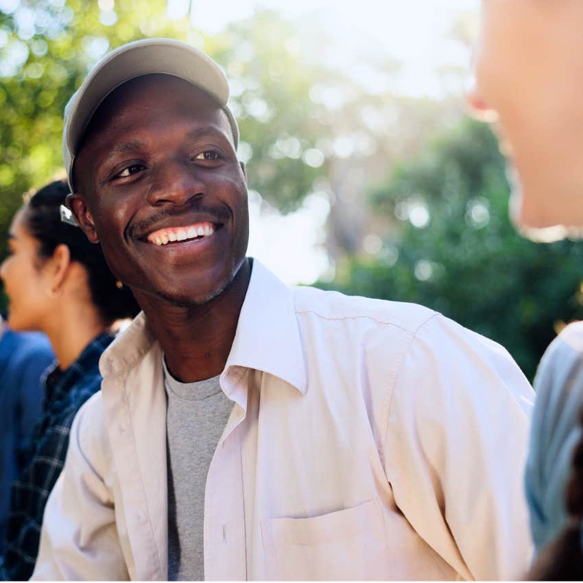 Man who asks amazing questions with people outside.
