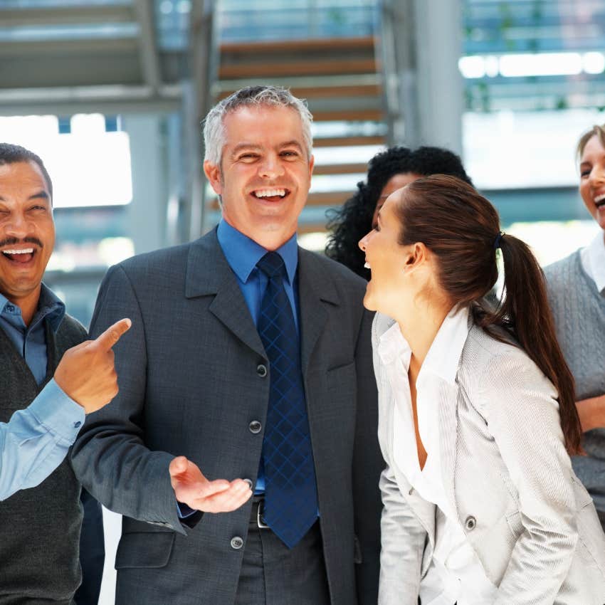 man being facetious to make his coworkers laugh