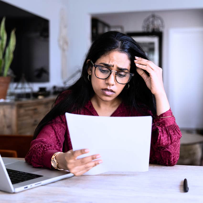 woman dealing with rejection reading letter
