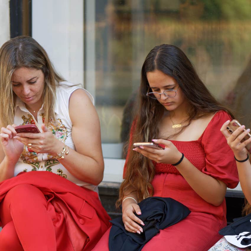 women checking how many social media followers they have