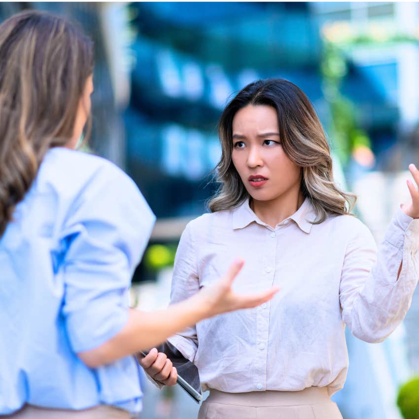 Angry woman saying "try and make me" to an authority figure at work.