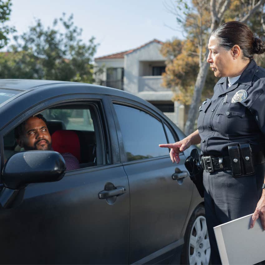 Frustrated man receiving a parking ticket after ignoring a posted rule