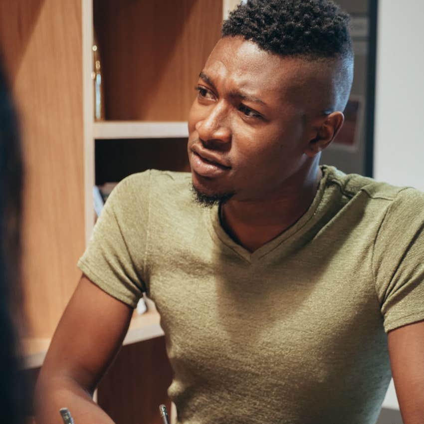 man with mental and emotional attitude problems telling colleague he doesnt like co-worker