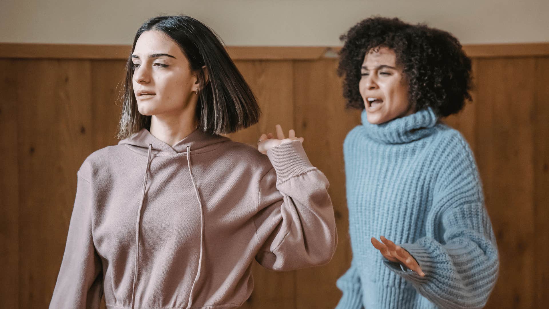 mental and emotional loner turning her back to her friend saying i'm fine on my own