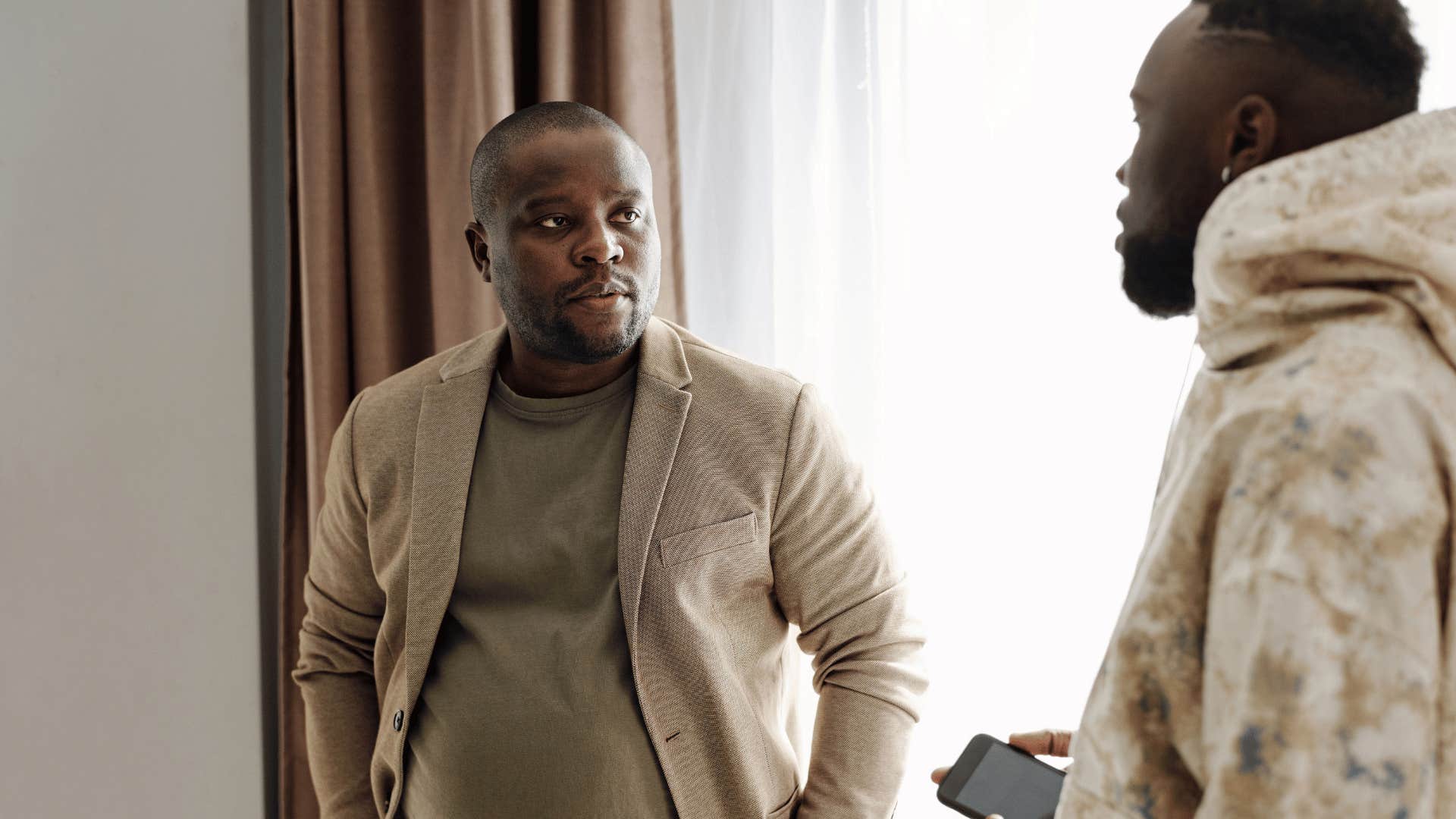 man who is a loner trusting his gut telling friend i have a feeling