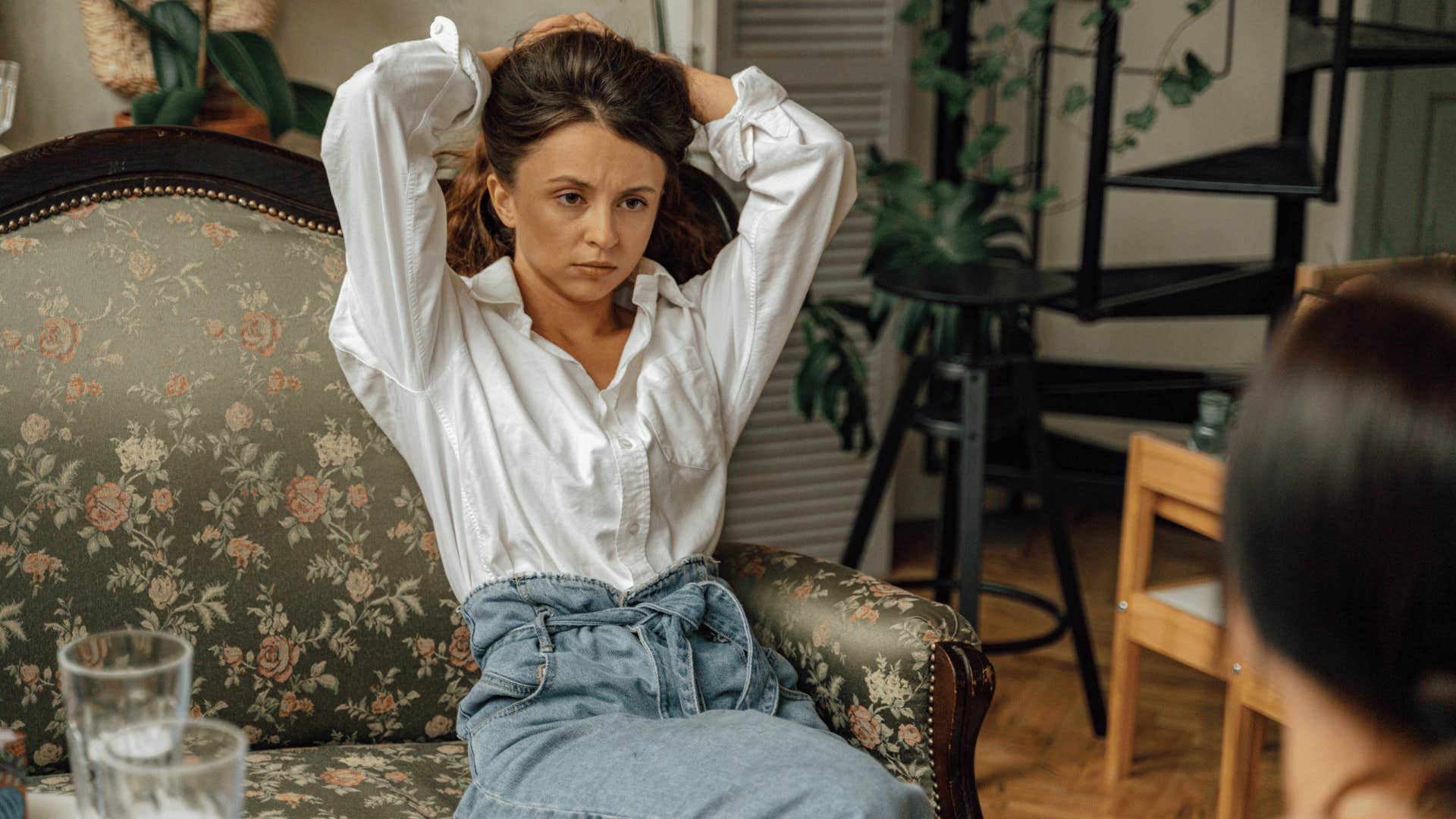 mental and emotional loner woman sitting across from friend saying i need space to think