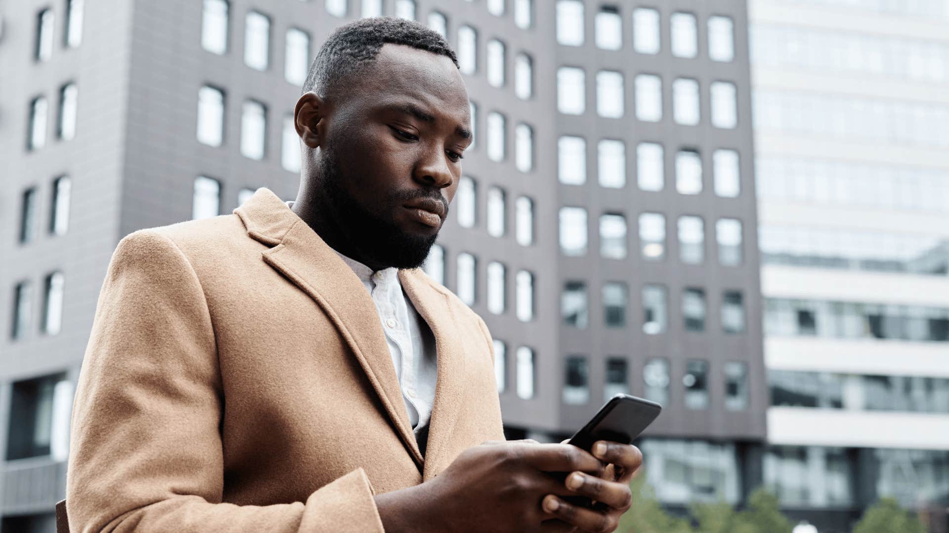 helpless man texting friend i can't make it