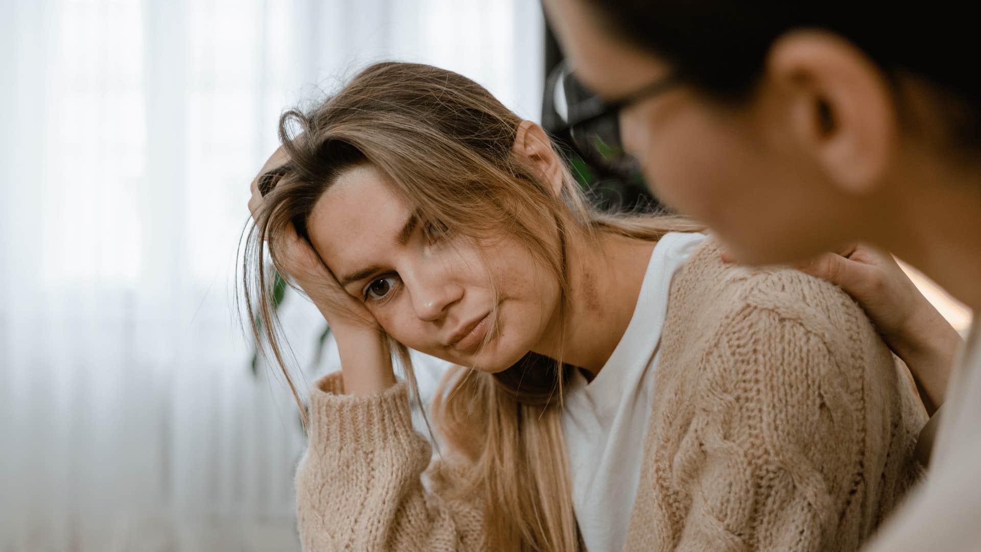 sad woman lacking resilience telling friend i'm worried