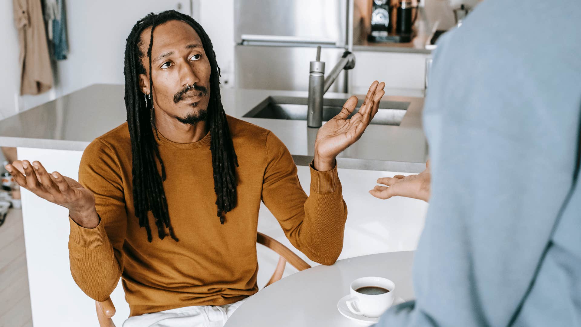 annoyed man telling partner i've never done that