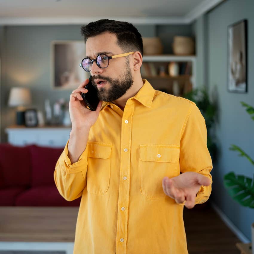 emotionally and socially uncomfortable man on phone telling person he is bad at talking to people