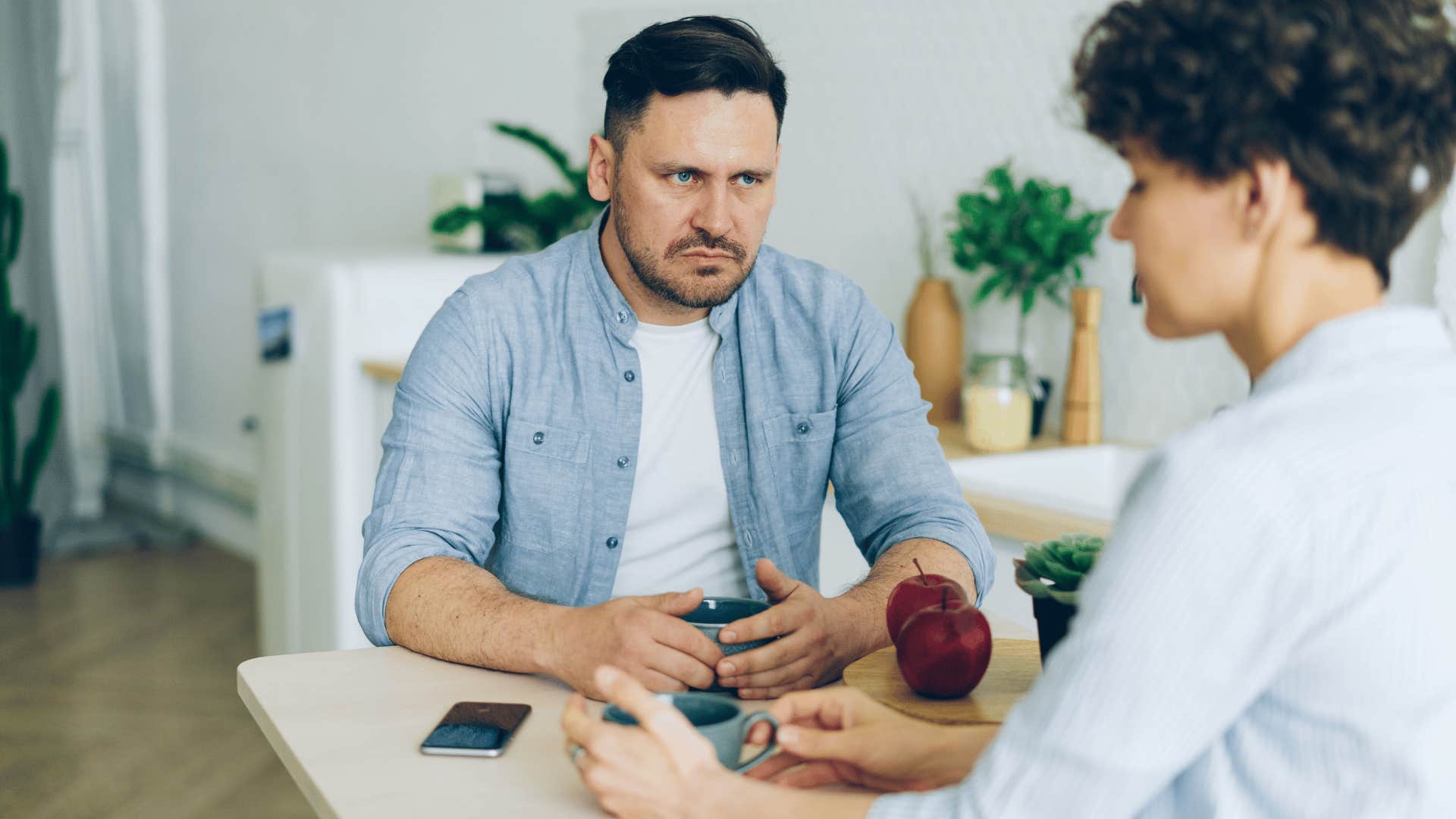 angry man talking to partner saying i'm not doing this