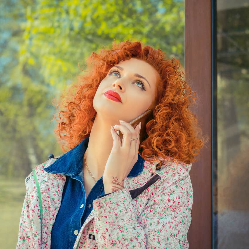 unintentionally passive-aggressive woman talking on phone saying whatever while rolling her eyes