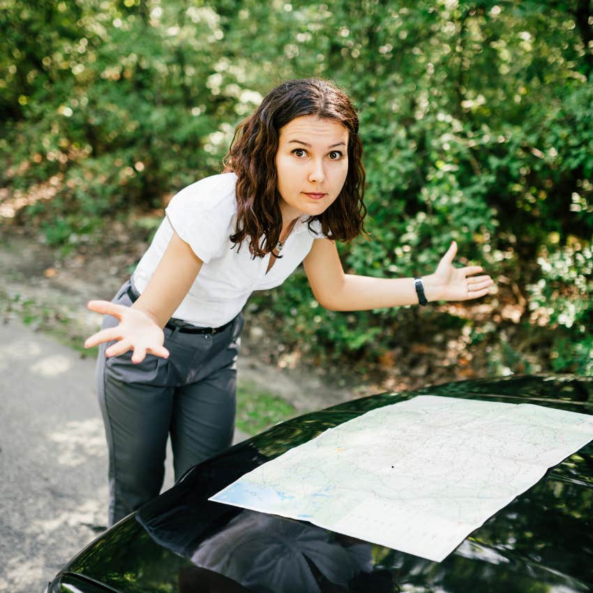 woman with high emotional intelligence lost while driving because she doesn't know which way to go